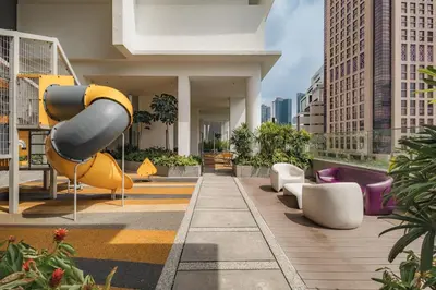 a playground in a building with a slide at Quill Residences by DX in Kuala Lumpur