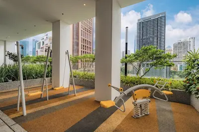 a gym in a building with a view of the city at Quill Residences by DX in Kuala Lumpur
