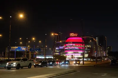 a busy city street at night with cars and buildings at Sunway Velocity Signature in Kuala Lumpur