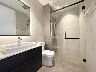 a bathroom with a sink and a toilet and a shower at Axon Bukit Bintang Cozy 1BR Suite with KLCC View in Kuala Lumpur