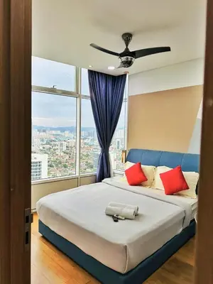 a bedroom with a large bed with a ceiling fan at Sky Suites KLCC by KD SKY Family Suites in Kuala Lumpur