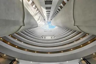 a view of a building with a spiral staircase at The Atrium at Jalan Ampang by OKBnB - Cozy 2Bedroom ,3 mins to Foreign Embassies in Kuala Lumpur