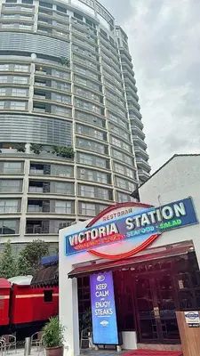 a restaurant in front of a large building at The Atrium at Jalan Ampang by OKBnB - Cozy 2Bedroom ,3 mins to Foreign Embassies in Kuala Lumpur