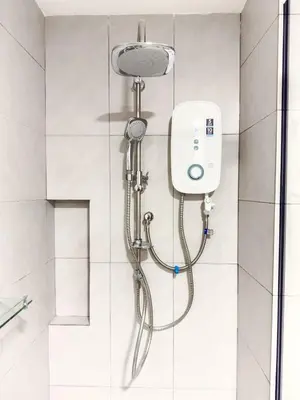 a shower with a shower head in a bathroom at The Atrium at Jalan Ampang by OKBnB - Modern 2Bedroom, 10 mins to Pavilion KL in Kuala Lumpur