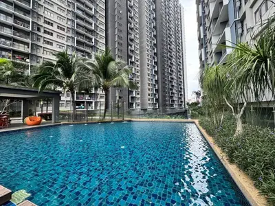 a large swimming pool in the middle of tall buildings at Peaceful 3BR 2B with Pool 10pax Wangsa Maju near Wangsa Walk in Kuala Lumpur