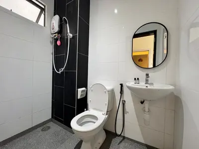 a bathroom with a sink and a toilet and a mirror at Peaceful 3BR 2B with Pool 10pax Wangsa Maju near Wangsa Walk in Kuala Lumpur