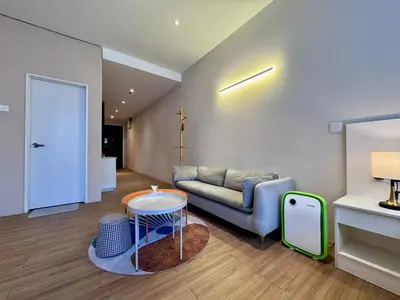 a living room with a couch and a table at NEW Bangsar Trade Centre KL Mid Valley LRT Bangsar in Kuala Lumpur