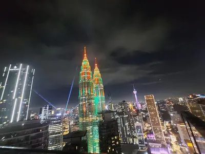 a lit up city skyline at night with at STAR Residences Home Stay Near By KLCC in Kuala Lumpur