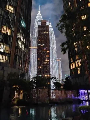 a view of a city at night with tall buildings at STAR Residences Home Stay Near By KLCC in Kuala Lumpur