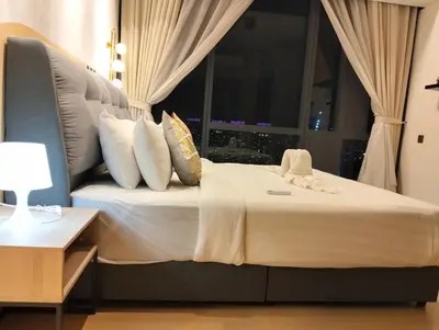 a large bed in a room with a window at STAR Residences Home Stay Near By KLCC in Kuala Lumpur