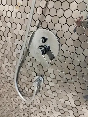 a bathroom with a urinal in a tiled wall at STAR Residences Home Stay Near By KLCC in Kuala Lumpur