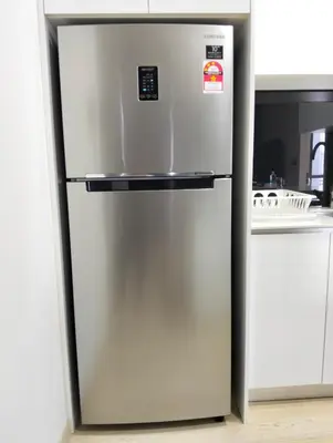 a stainless steel refrigerator in a kitchen at STAR Residences Home Stay Near By KLCC in Kuala Lumpur