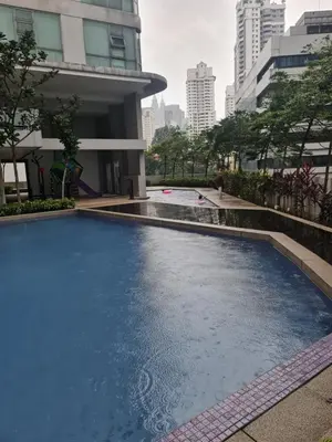 a swimming pool in front of a building at ROBERTSON RESIDENCE south SUITES IN KUALA LUMPUR in Kuala Lumpur