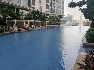 a large swimming pool in a city with buildings at ROBERTSON RESIDENCE south SUITES IN KUALA LUMPUR in Kuala Lumpur