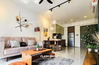 a living room with a couch and a table at Agile Bukit Bintang Premium Suites at KLCC in Kuala Lumpur