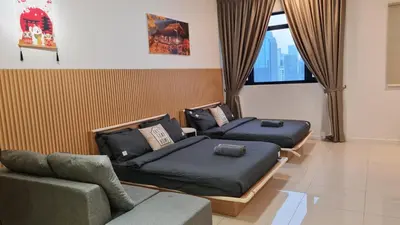 two beds in a room with a couch and a window at Chambers Suites KL By 969 in Kuala Lumpur