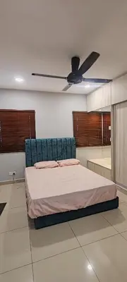 a bedroom with a bed and a ceiling fan at Maxim Citylights in Kuala Lumpur