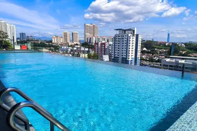 a large swimming pool on the roof of a building at Hartamas Societe by MYAbnb in Kuala Lumpur
