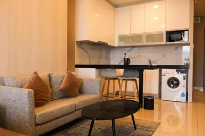 a living room with a couch and a table at Hartamas Societe by MYAbnb in Kuala Lumpur