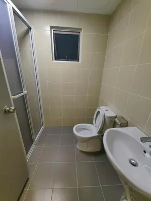 a bathroom with a toilet and a sink at Razak City Residences dudu in Kuala Lumpur