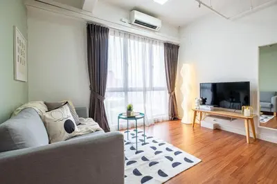 a living room with a couch and a television at Menara Arina Uniti 3km to KLCC 2BR 4Pax Mini Home in Kuala Lumpur