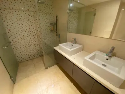 a bathroom with a sink and a mirror at Skypool KL Free Infinity Pool over Kuala Lumpur in Kuala Lumpur