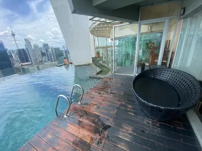 a swimming pool on the roof of a building at Skypool KL Free Infinity Pool over Kuala Lumpur in Kuala Lumpur