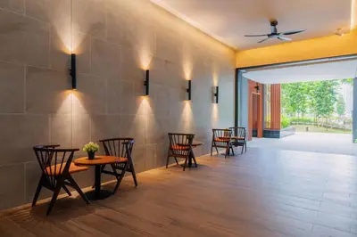a dining room with chairs and tables and a ceiling at Agile Bukit Bintang KLCC by DX in Kuala Lumpur