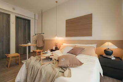 a bedroom with a large white bed with pillows at Agile Bukit Bintang KLCC by DX in Kuala Lumpur