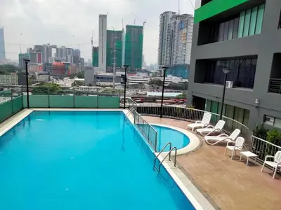 a large swimming pool on top of a building at 103 Hotel in Kuala Lumpur