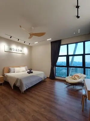 a bedroom with a bed and a large window at Arte Mont Kiara 4BR 8pax-10pax, 10mins to KLCC in Kuala Lumpur