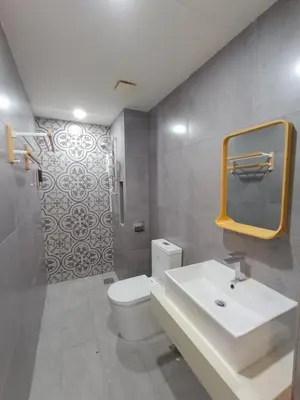 a bathroom with a sink and a toilet and a mirror at Arte Mont Kiara 4BR 8pax-10pax, 10mins to KLCC in Kuala Lumpur