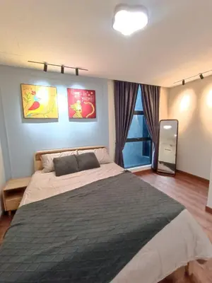 a bedroom with a large bed and a window at Arte Mont Kiara 4BR 8pax-10pax, 10mins to KLCC in Kuala Lumpur