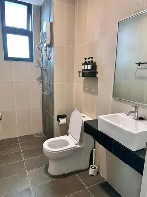 a bathroom with a toilet and a sink at Home away from home near KLCC in Kuala Lumpur
