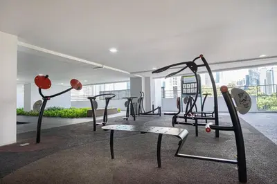 a gym with several exercise equipment in a room at Home away from home near KLCC in Kuala Lumpur