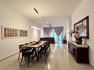a dining room with a table and chairs at Home away from home near KLCC in Kuala Lumpur
