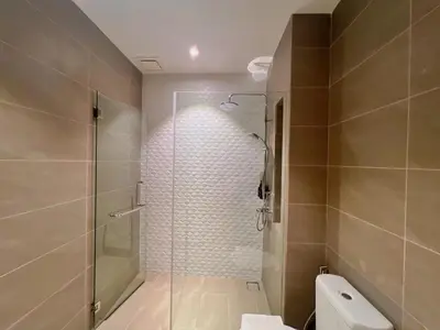 a bathroom with a glass shower and a toilet at Lovely & Comfy Quill Residence, Near Monorail& Quill City Mall in Kuala Lumpur