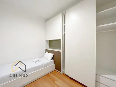 a bedroom with a bed and a closet at The Platinum KLCC by Archos in Kuala Lumpur