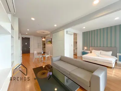 a living room with a couch and a bed at The Platinum KLCC by Archos in Kuala Lumpur