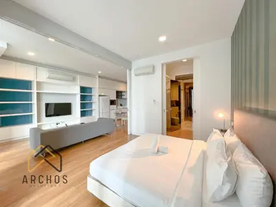 a bedroom with a large bed and a bathroom at The Platinum KLCC by Archos in Kuala Lumpur