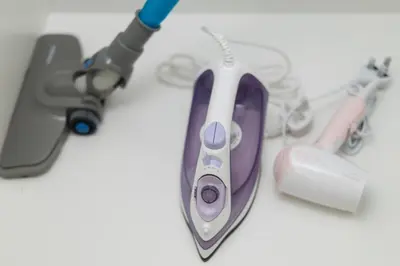 a purple and white computer mouse sitting on a table at Backpackers Studio at Neu Suites Ampang in Kuala Lumpur