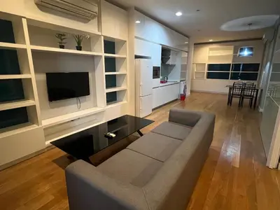 a living room with a couch and a flat screen tv at Platinum Kuala Lumpur by Sleepy Owl Suites in Kuala Lumpur