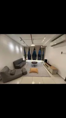 a living room with a couch and a table at Matt suite home in Kuala Lumpur