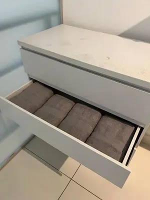 a white drawer with some brown towels in it at Matt suite home in Kuala Lumpur