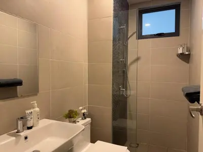 a bathroom with a toilet and a sink and a shower at KL TRX view # IKEA MRT # 2 BED 2BATH # Continew KL in Kuala Lumpur