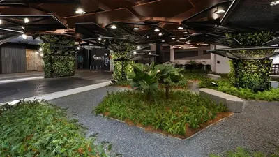 a building with a bunch of plants and trees at KL TRX view # IKEA MRT # 2 BED 2BATH # Continew KL in Kuala Lumpur
