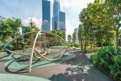 a playground in a park with a city in the background at Agile Bukit Bintang by KAN's in Kuala Lumpur