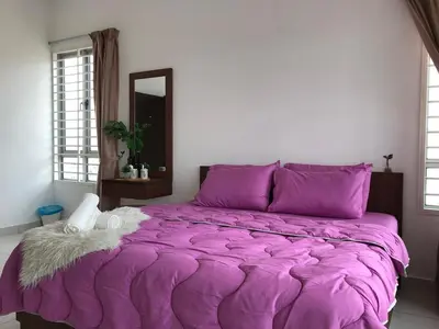 a large purple bed in a room with a mirror at Ampang 4-6 pax in Ampang Point in Ampang