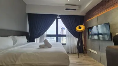 a bedroom with a bed with a teddy bear on it at Agile Pavillion TRX Luxury Suited Kuala Lumpur Good View in Kuala Lumpur