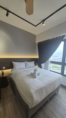 a bedroom with a large bed with a large window at Agile Pavillion TRX Luxury Suited Kuala Lumpur Good View in Kuala Lumpur